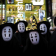 Halloween goers dressed up as No-Face.
